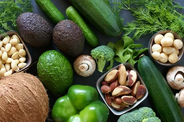 Fotobehang Ketogenic Diet.Lchf. Vegetables and nuts for low carb diet.Vegetables and nuts. Avocado, coconut, macadamia, Brazil nuts, zucchini, cucumber, mushrooms, broccoli, almonds. Green vegetables for keto. © Yuliya