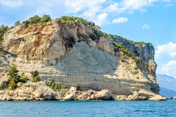 Fototapeta na wymiar Rocks off the Mediterranean coast (Kemer region) in Turkey