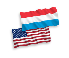 National vector fabric wave flags of Luxembourg and USA isolated on white background. 1 to 2 proportion.