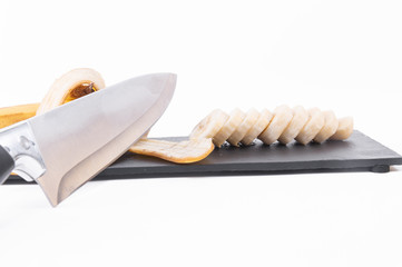 Sliced Banana And Knife. close up
