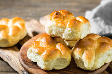 Buns on wooden background. Rustic pastries. Rustic style