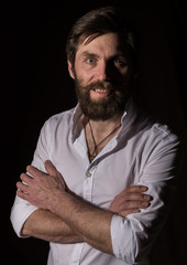 Obraz premium Portrait handsome bearded man, sexy guy on a dark background