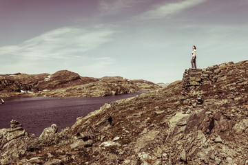 Tourist enjoying landscape norwegian nature