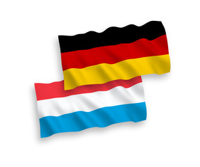 National vector fabric wave flags of Germany and Luxembourg isolated on white background. 1 to 2 proportion.