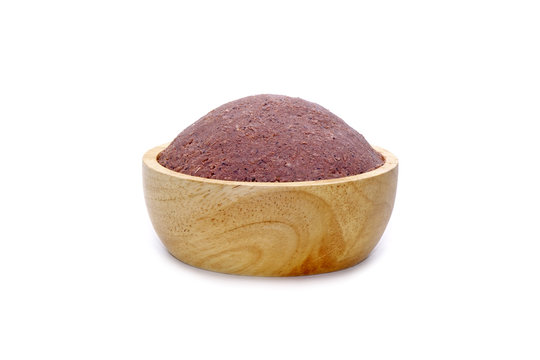 Shrimp paste (Kapi) in wooden bowl isolated on white background. Shrimp paste or Shrimp sauce is a fermented condiment, important ingredient of Thai food and many Southeast Asian food.