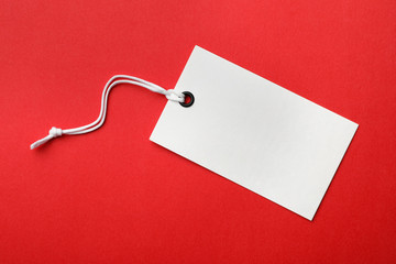 Cardboard tag with space for text on color background, top view