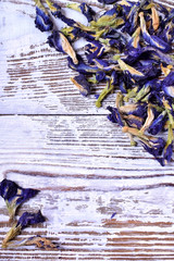 Dry blue anchan tea on the white wooden board
