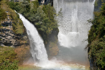 Fototapeta premium Two large waterfalls form a rainbow
