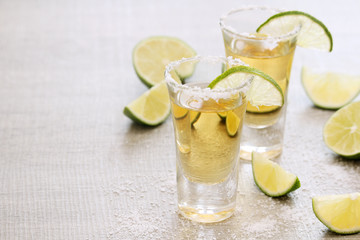 Tequila shots with sliced lime