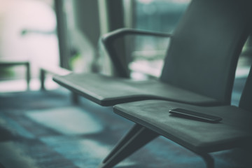 Passenger lost mobile phone on the airport chair