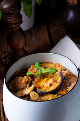 Veal goulash with baked aubergine and herbs