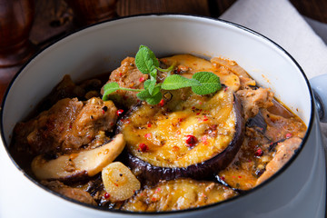 Veal goulash with baked aubergine and herbs
