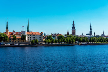 Naklejka premium Cityscape of River and Riga Latvia on a Clear Sunny Day