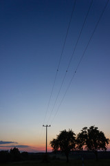 telegraph pole at colorful sunset