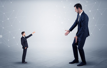 Small businessman aiming at a big businessman with connection and network concept
