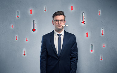 Young tired businessman with thermometer and fever concept
