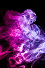 Colored smoke on black background