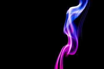 Obraz premium Colored smoke on black background