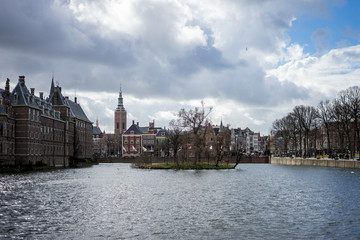 Fototapeta premium Den Haag, Netherlands, , Binnenhof, RIVER AMIDST BUILDINGS AGAINST SKY IN CITY