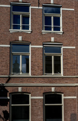 Fototapeta na wymiar Den Haag, Netherlands, , a fireplace in front of a brick building