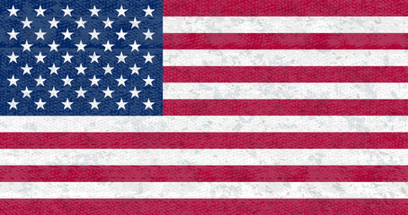 Grunge flag of USA. Isolated American banner with scratched texture on denim fabric. Flat style, vector with noise, marble textured background. Horizontal orientation.