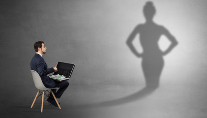 Rich businessman staying and offering stuffs to a pretty shadow woman

