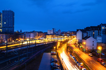 Fototapeta na wymiar Main train station in Mainz, Germany at night. Illuminated streets