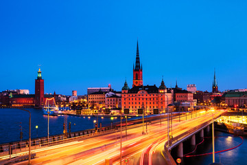 View of Gamla Stan in Stockholm, Sweden with landmarks like Riddarholm Church during the night