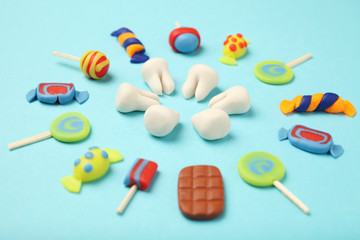 Teeth with sweet candies. Tooth caries in children's, dental healthcare.