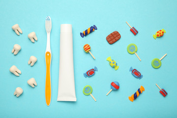 Teeth with sweet candies. Tooth caries in children's, dental healthcare, toothpaste and toothbrush.