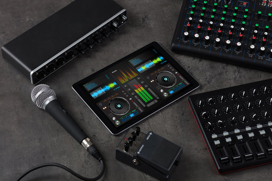 Mixing music on tablet with electronic music instruments concept
- Powered by Adobe