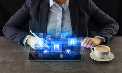 Business woman working on tablet with online ERP system concept and dark background
