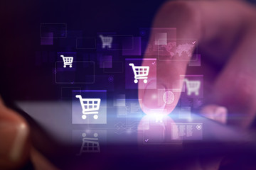 Finger touching phone with online shopping concept and dark background
