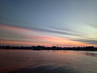 the sky when the sun will rise in the river