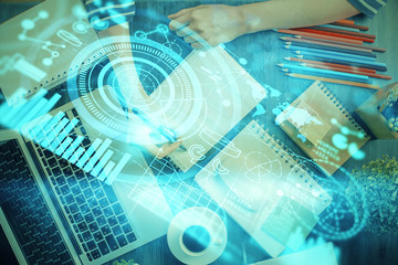 International business hud over woman's hands writing background. Concept of hard work. Double exposure