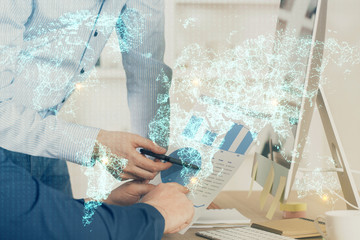 Social network theme hologram with businessman working on computer on background. Multi exposure.