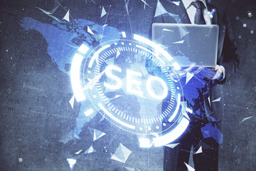 Multi exposure of seo icon with man working on computer on background. Concept of search engine...