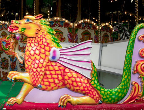 Painted dragon carrige on merry-go-around ride