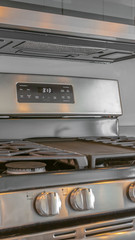 Obraz premium Panorama Close up of the cooktop of a range under wall mounted microwave inside a kitchen