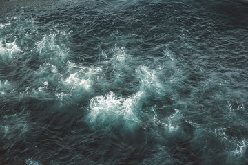 Fototapeta na wymiar Aerial view to ocean waves. Blue water background