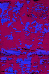 Fototapeta na wymiar Background image of close up peeled blue and red color textured wooden building exterior surface