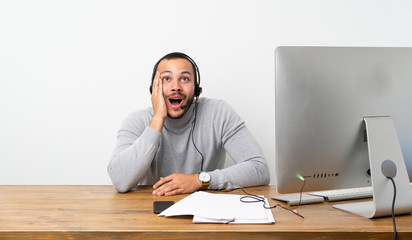 Telemarketer Colombian man with surprise and shocked facial expression