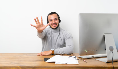 Telemarketer Colombian man counting five with fingers