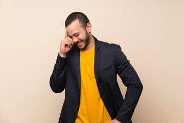 Colombian man over isolated background laughing