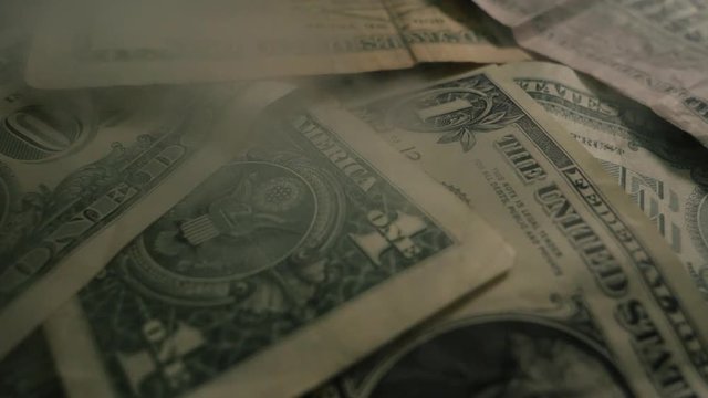 Dollar bills, money background. Dollars money set Slow Pan With Shallow Dof and smoke. Dollars, money close up.