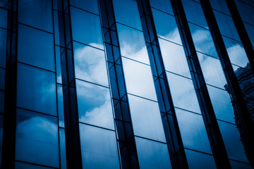 Clouds Reflected in Windows of Modern Office Building.