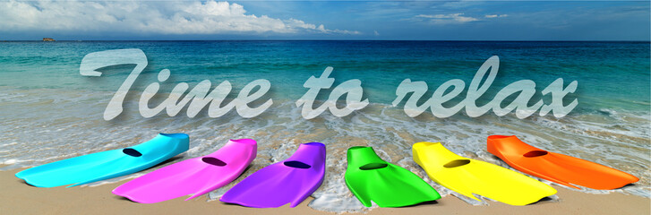 romantic tropical beach and ocean with multicolored diving fins in the summer sun