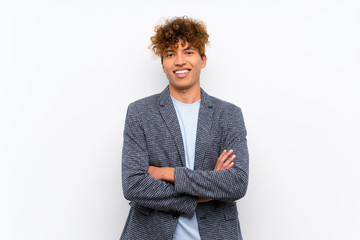 Fashion african american man over isolated white wall keeping the arms crossed in frontal position