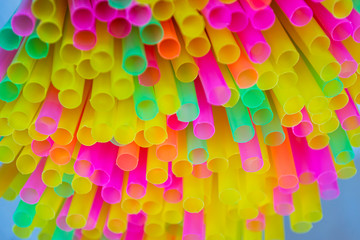 Colorful plastic straws drinking background