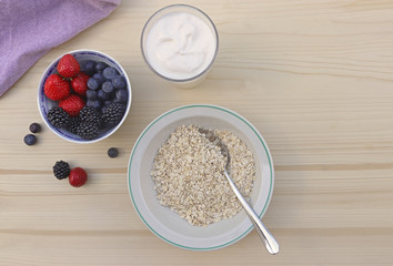 healthy breakfast with oats, natural yoghurt and berries